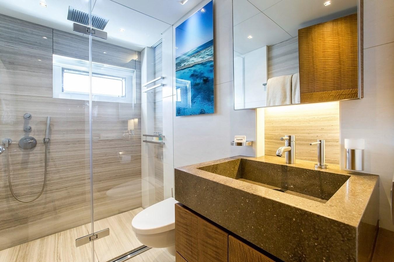 a bathroom with a glass shower aboard RUYA Yacht for Sale
