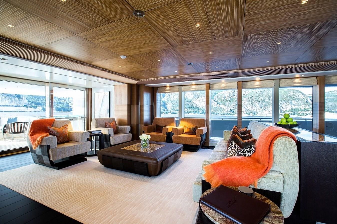 a living room with a large window aboard RUYA Yacht for Sale