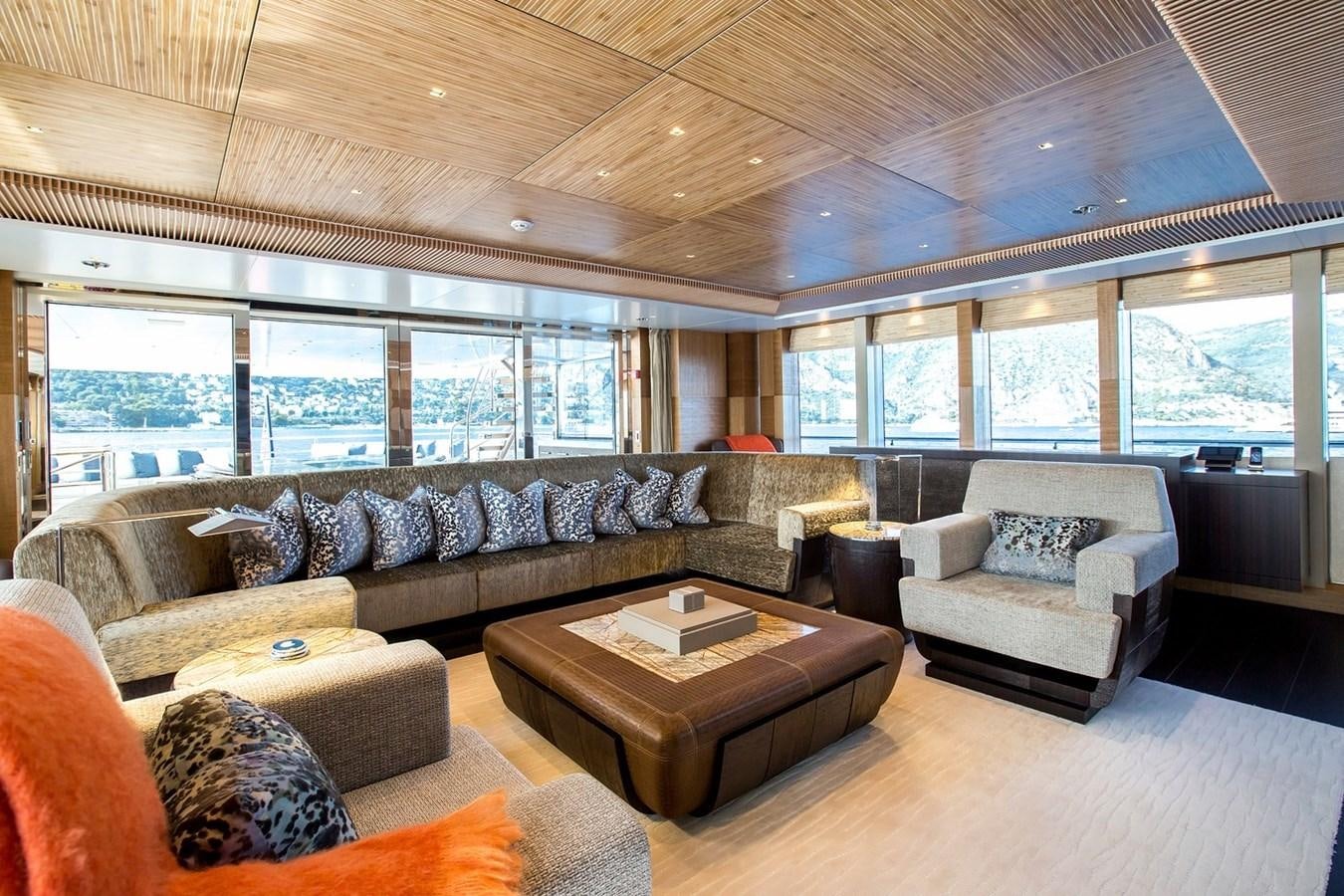 a living room with a large window aboard RUYA Yacht for Sale