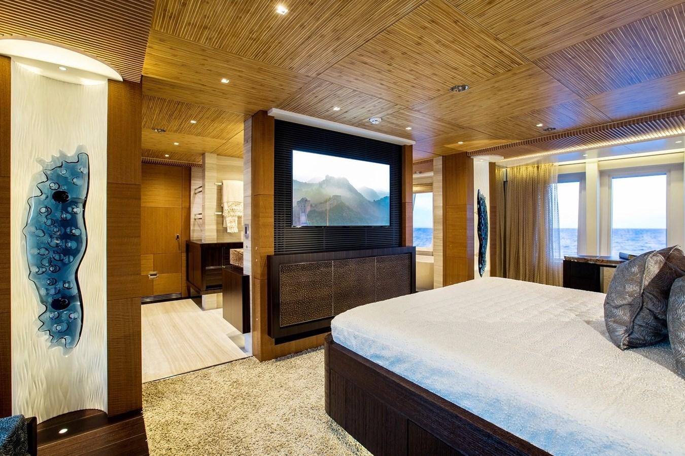 a bedroom with a large bed aboard RUYA Yacht for Sale