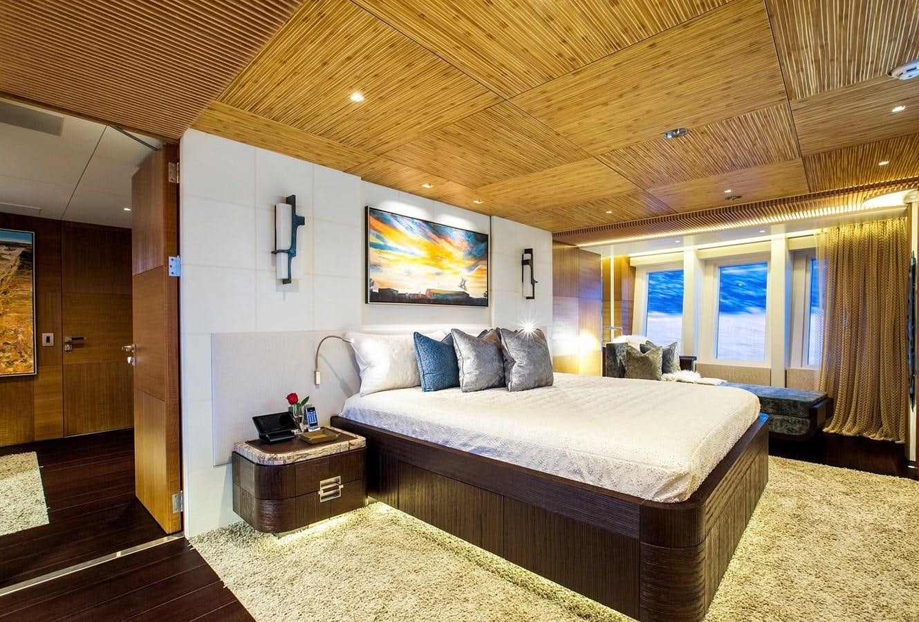 a bedroom with a large bed aboard RUYA Yacht for Sale