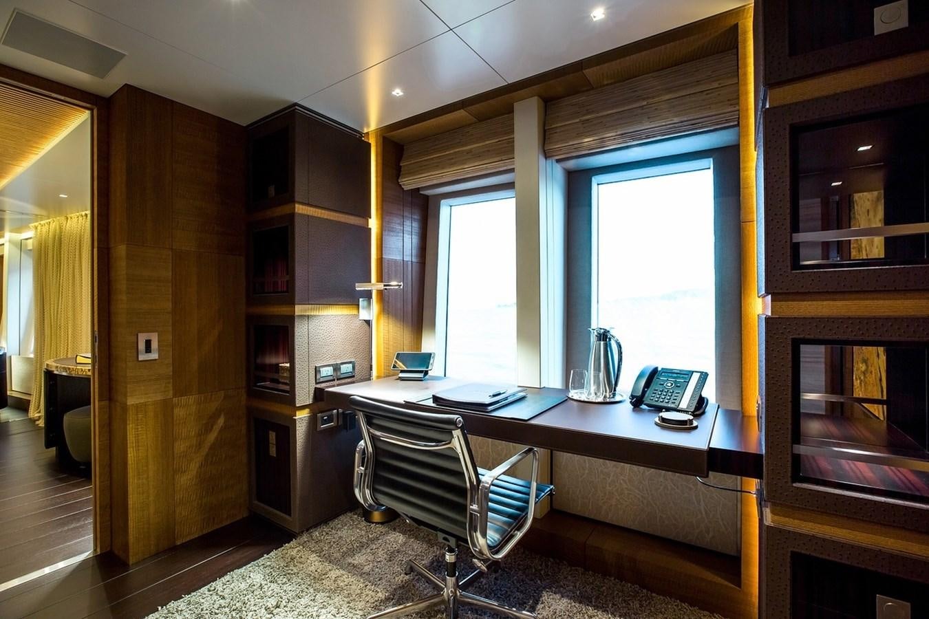 a room with a desk and a chair aboard RUYA Yacht for Sale