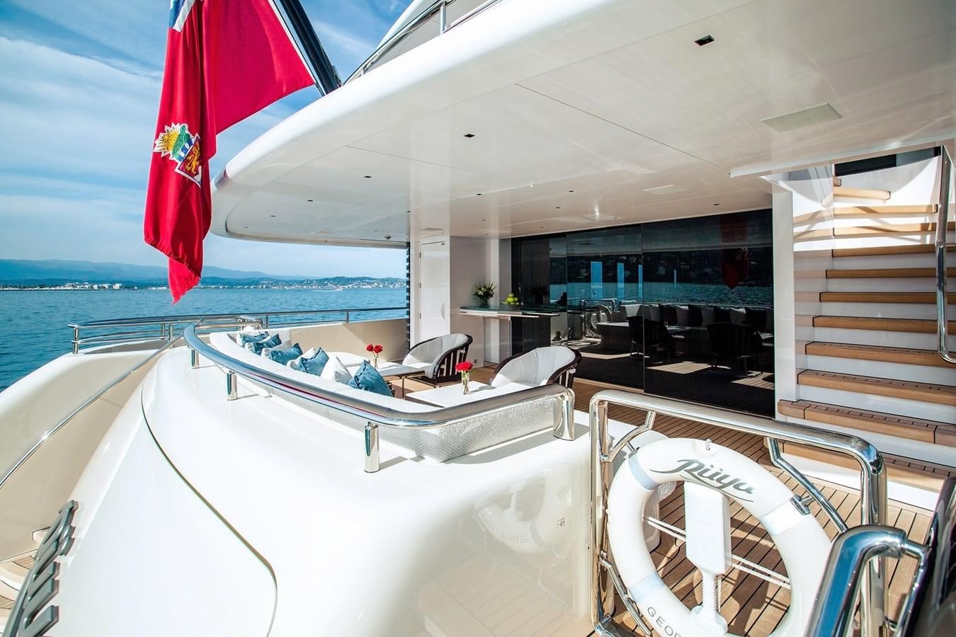 a boat with a flag on the deck aboard RUYA Yacht for Sale