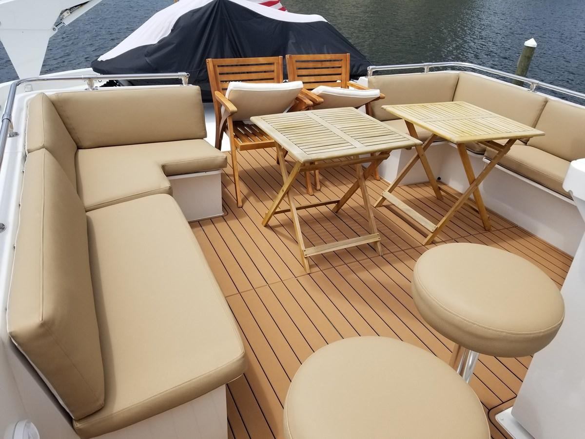 a boat with chairs around it aboard SEA SENOR Yacht for Sale