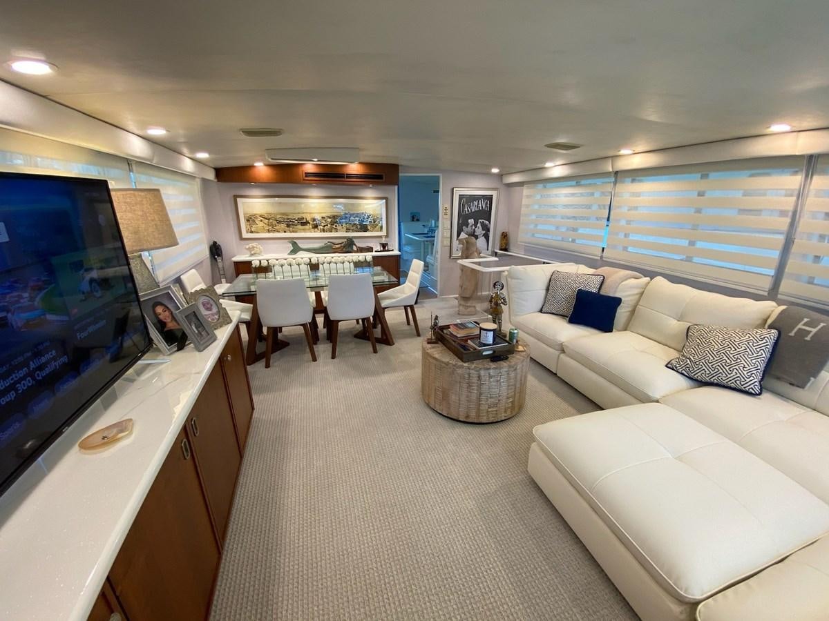 a living room with a large screen aboard SEA SENOR Yacht for Sale