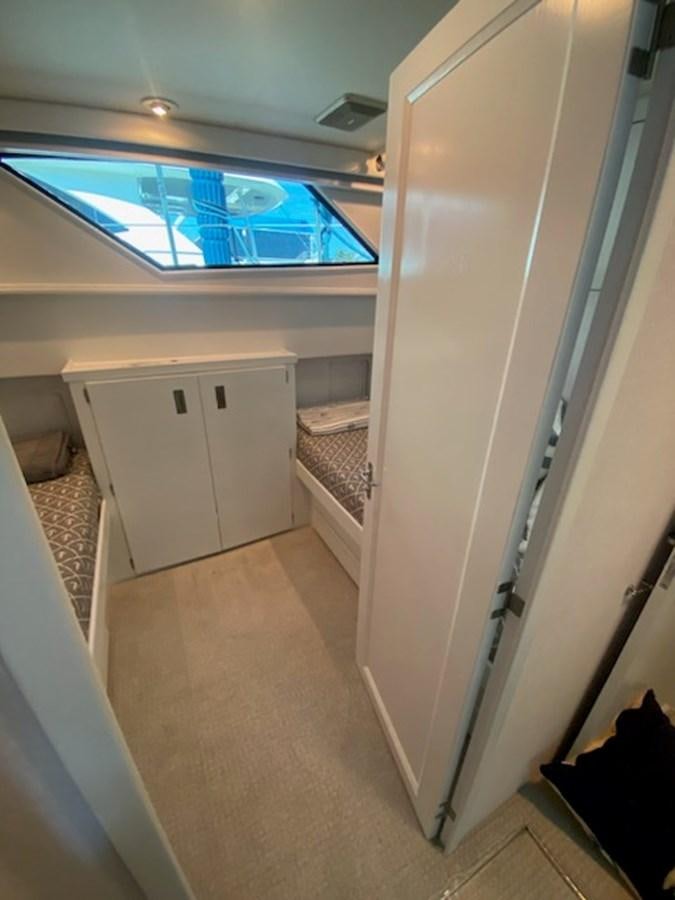 a room with a window and a door aboard SEA SENOR Yacht for Sale