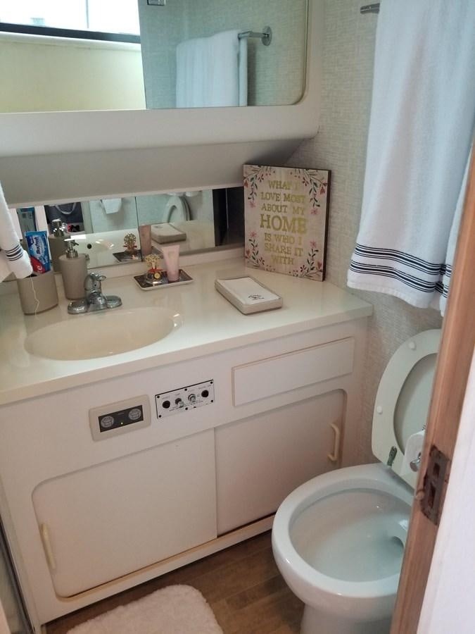 a bathroom with a toilet and sink aboard SEA SENOR Yacht for Sale