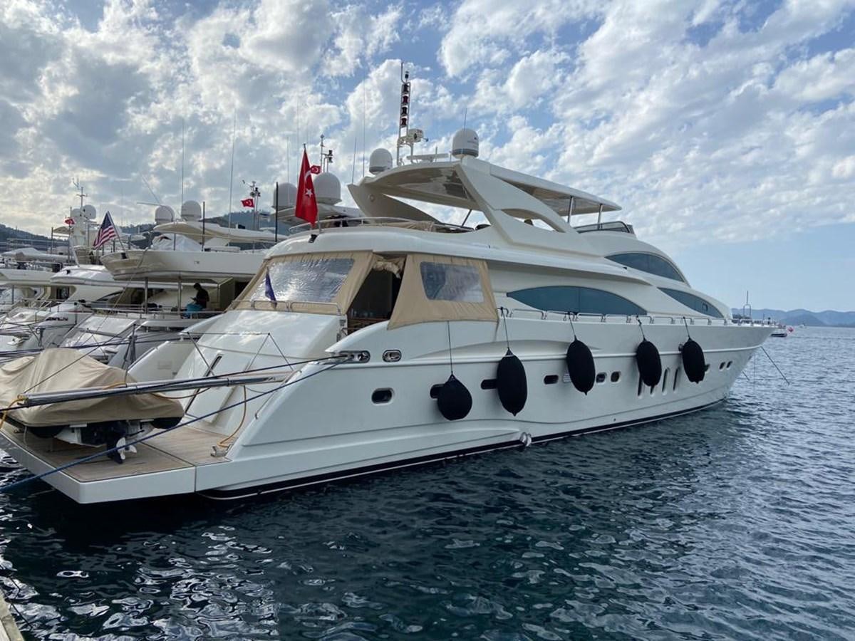 a white yacht on the water aboard CORAL Yacht for Sale