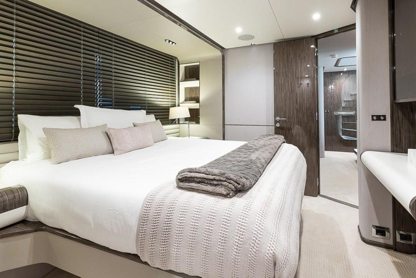a large bed in a room aboard DESIREE Yacht for Sale