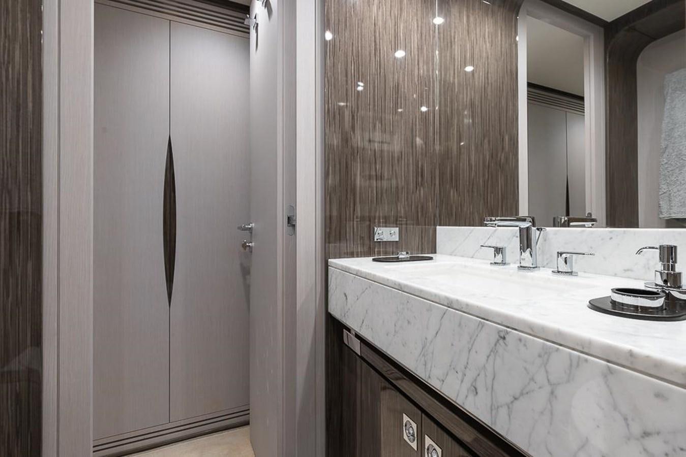 a bathroom with a countertop sink and a shower aboard DESIREE Yacht for Sale