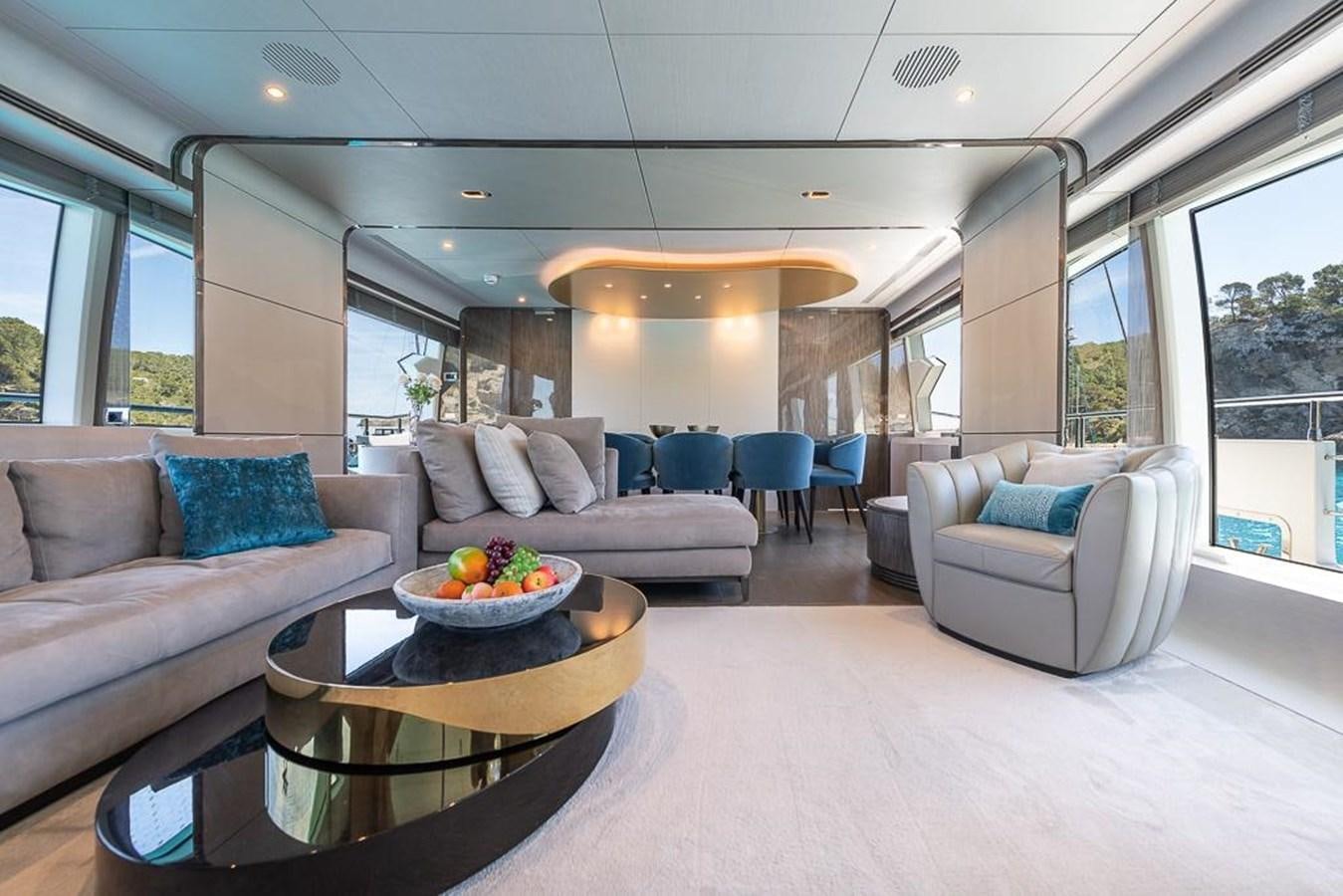 a living room with a couch and a coffee table aboard DESIREE Yacht for Sale