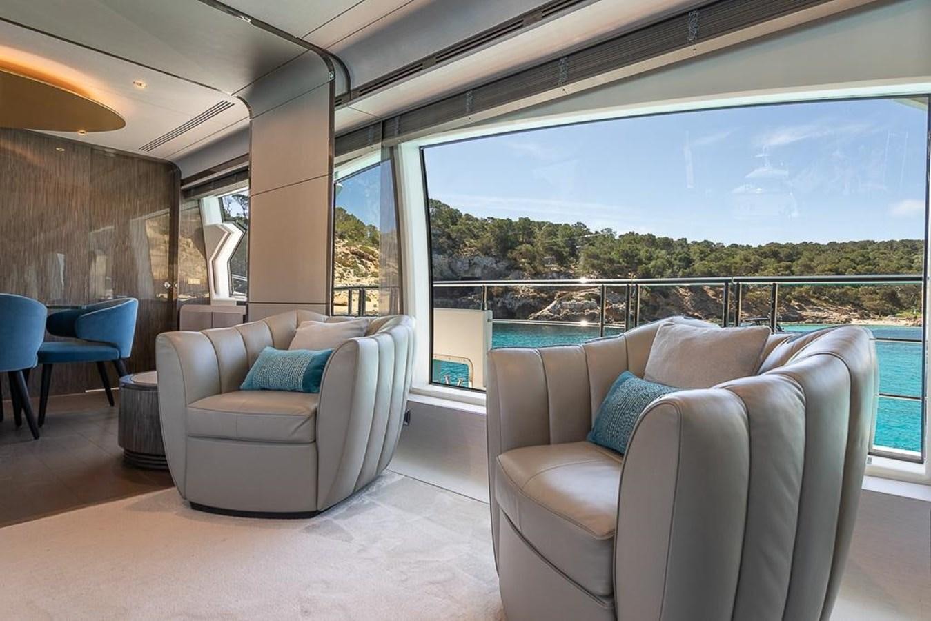 a living room with a view of the city aboard DESIREE Yacht for Sale