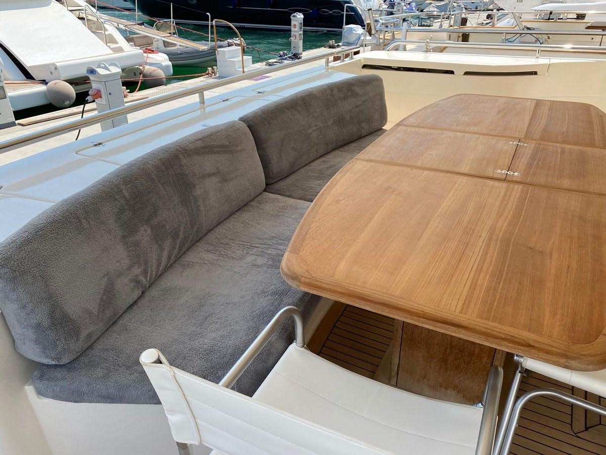 a couch on a table aboard DELMARE Yacht for Sale