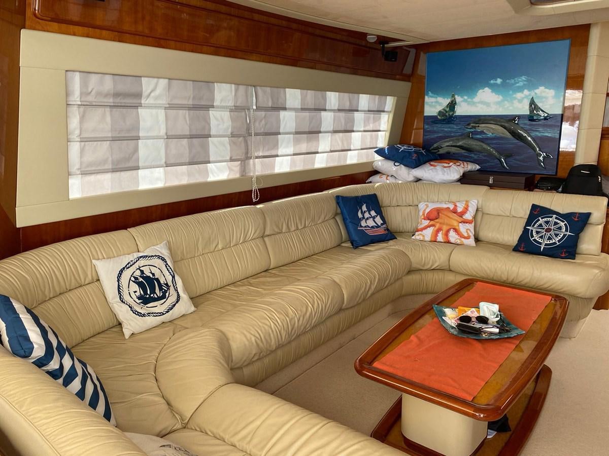 a living room with a couch and a tv aboard DELMARE Yacht for Sale