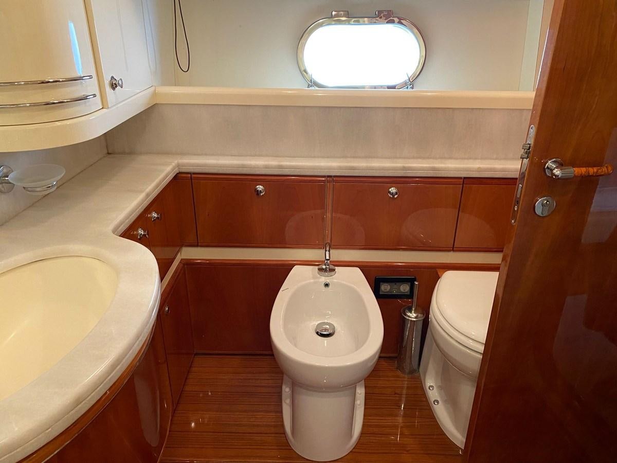 a bathroom with a toilet and sink aboard DELMARE Yacht for Sale