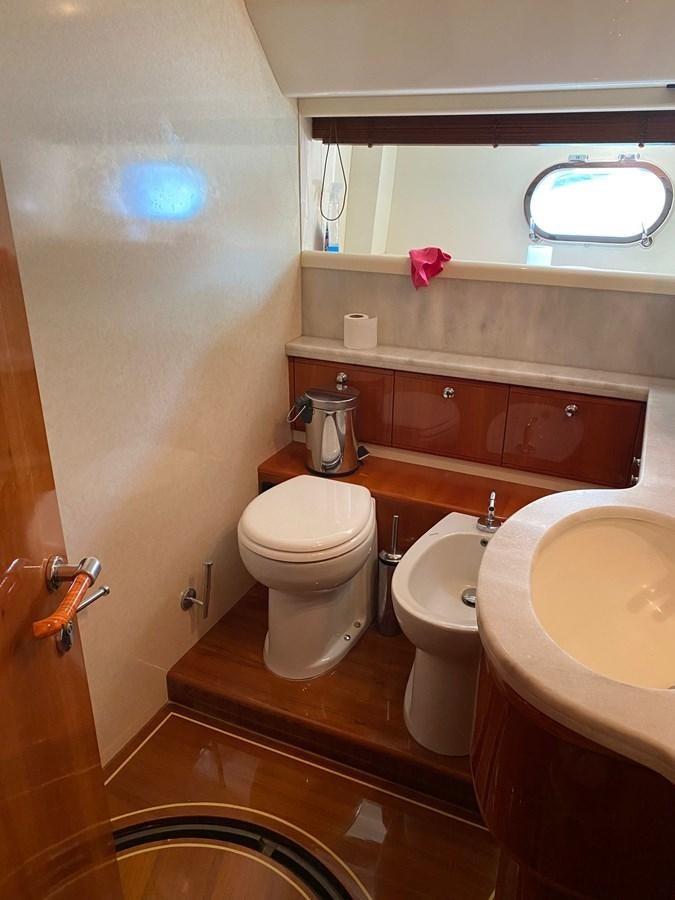 a bathroom with a toilet and sink aboard DELMARE Yacht for Sale