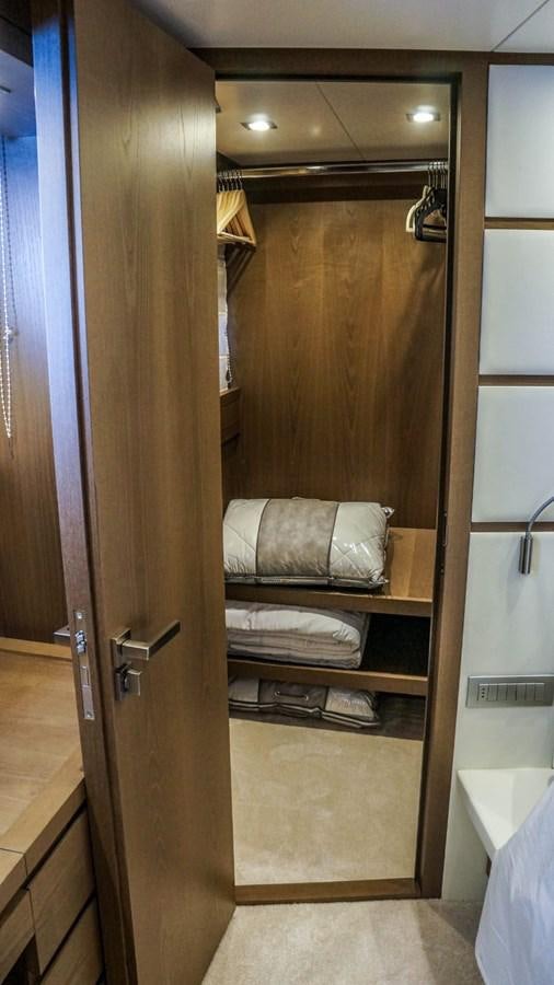 a closet with a towel rack aboard KUUM Yacht for Sale