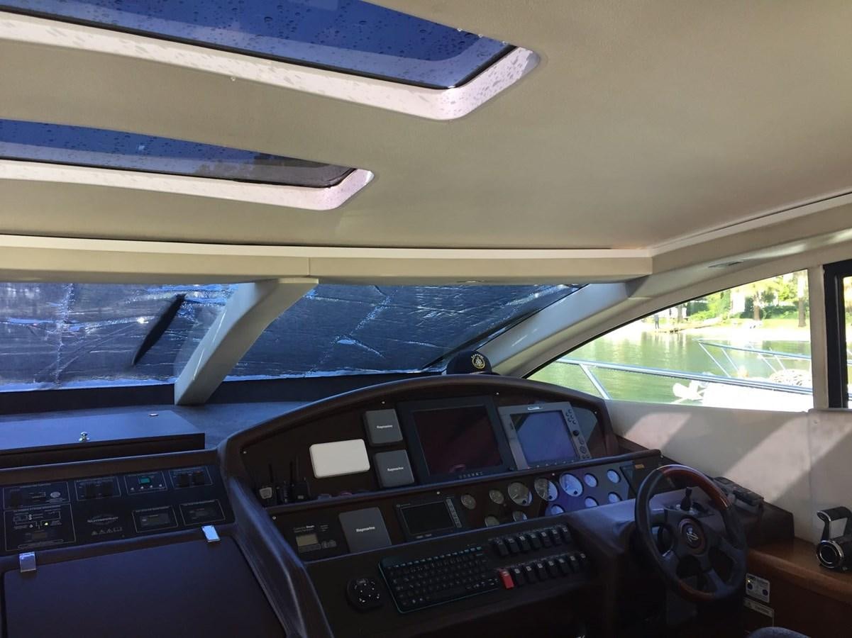 a car with a screen and buttons aboard JUNIOR Yacht for Sale