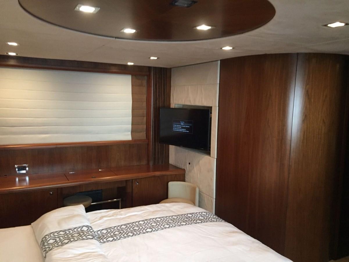a room with a bed and a tv aboard JUNIOR Yacht for Sale