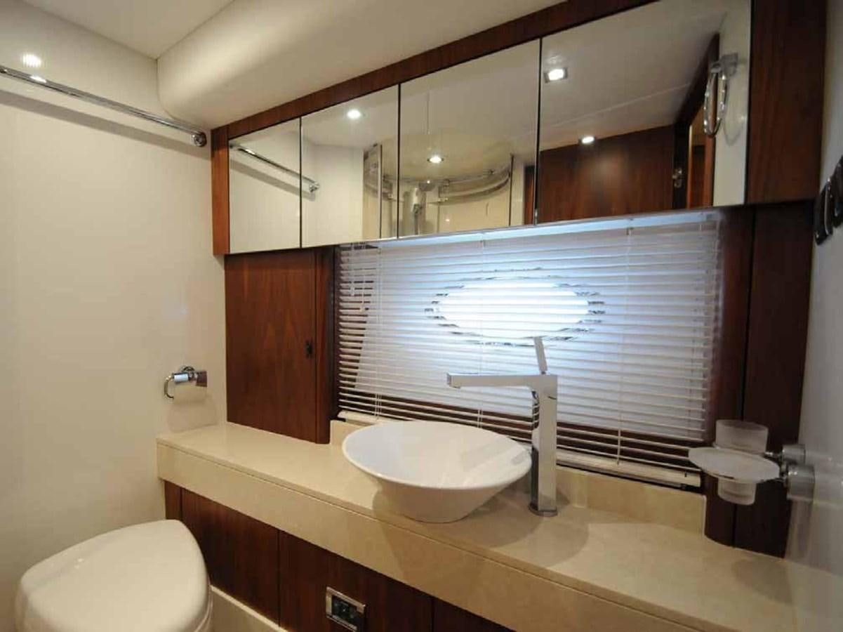 a bathroom with a large mirror aboard JUNIOR Yacht for Sale