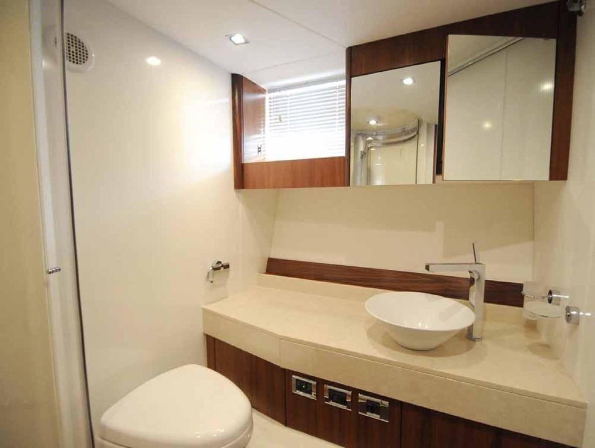 a bathroom with a sink and a toilet aboard JUNIOR Yacht for Sale