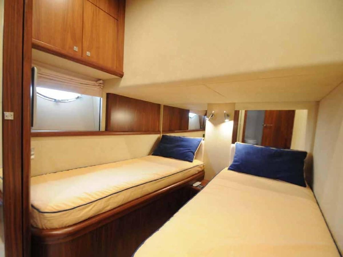 a room with two beds aboard JUNIOR Yacht for Sale