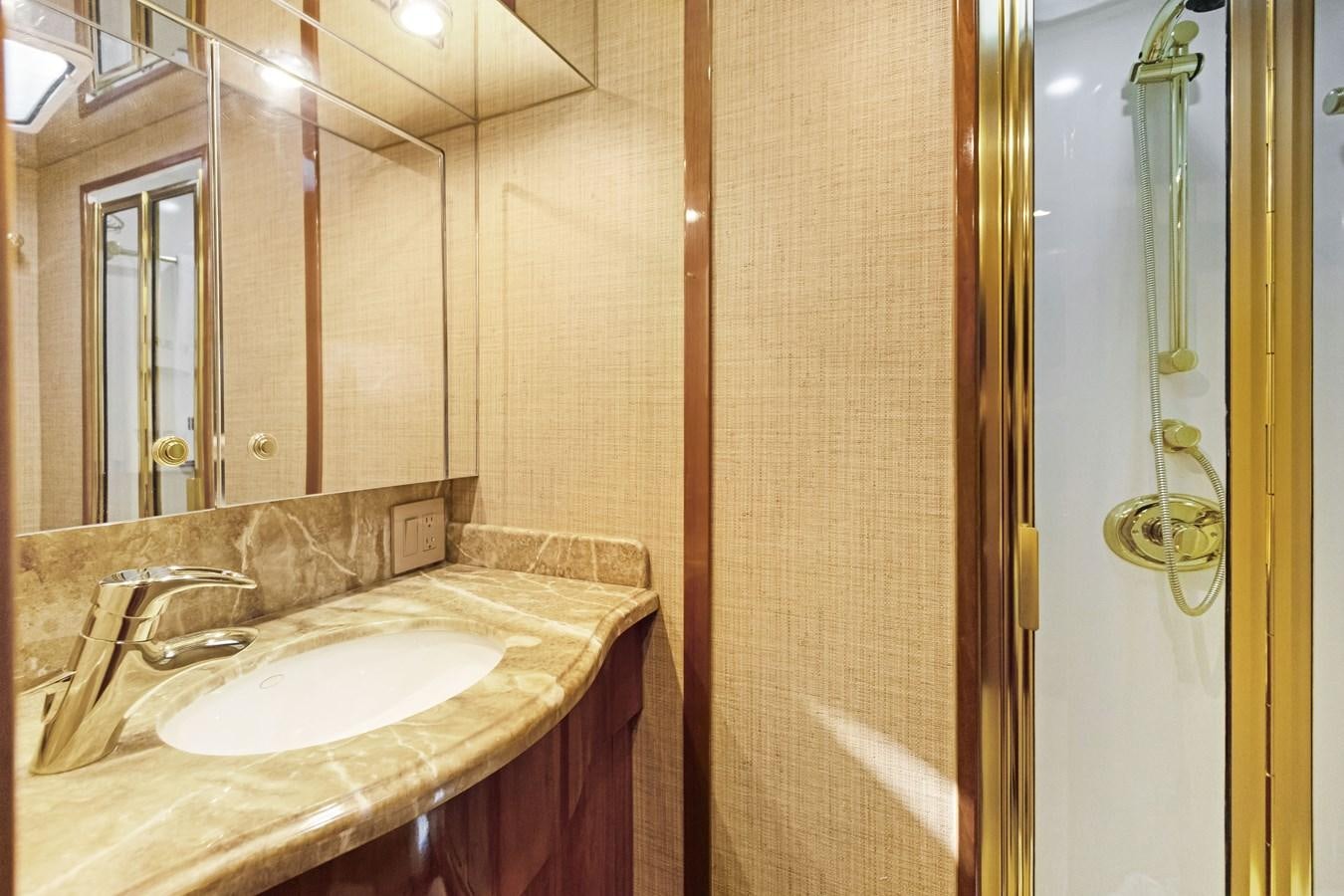 a bathroom with a sink and a mirror aboard TRUE XII Yacht for Sale