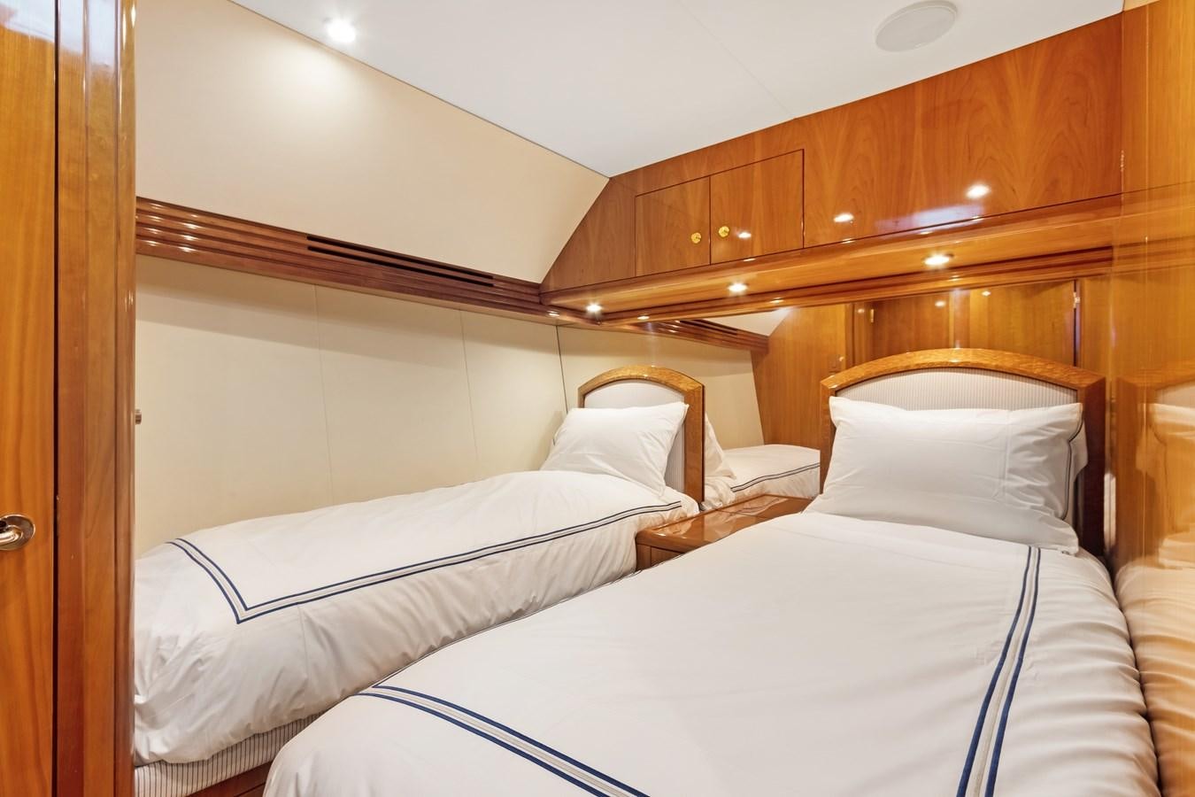 a room with two beds aboard TRUE XII Yacht for Sale