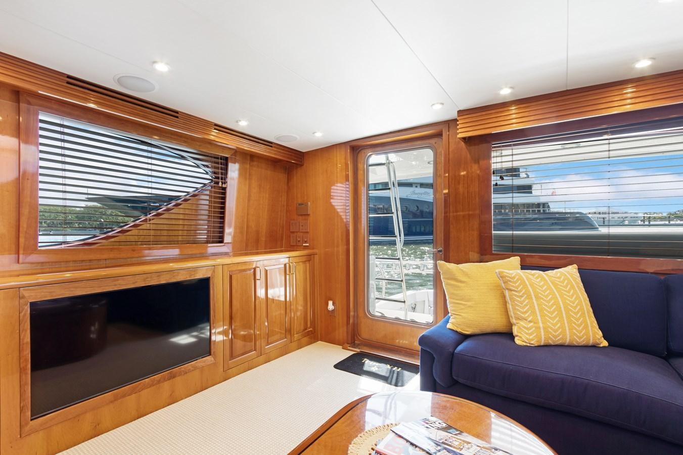 a living room with a couch and a tv aboard TRUE XII Yacht for Sale