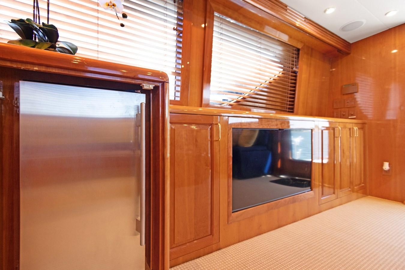 a room with wooden cabinets aboard TRUE XII Yacht for Sale