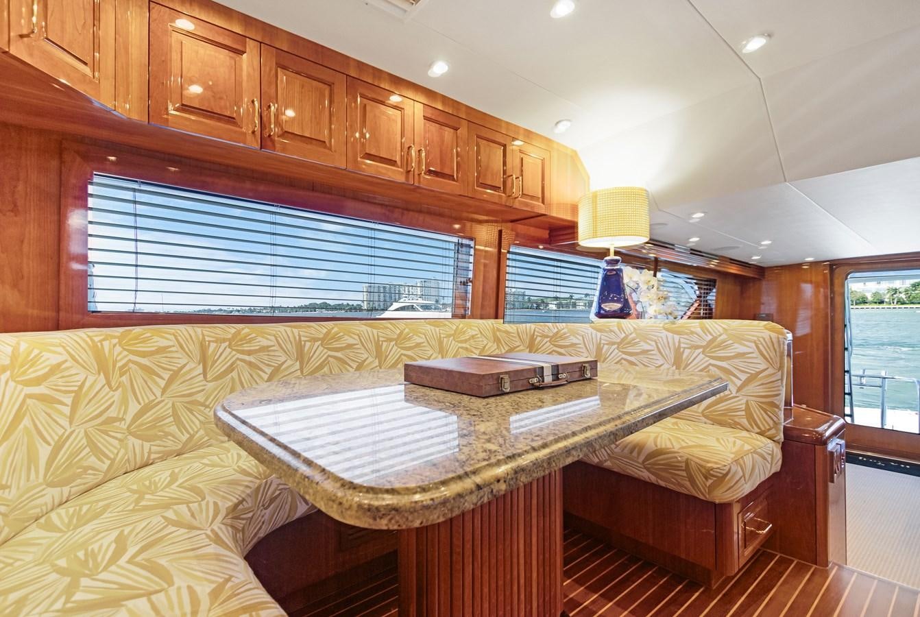 a large wooden kitchen with a large wooden table aboard TRUE XII Yacht for Sale