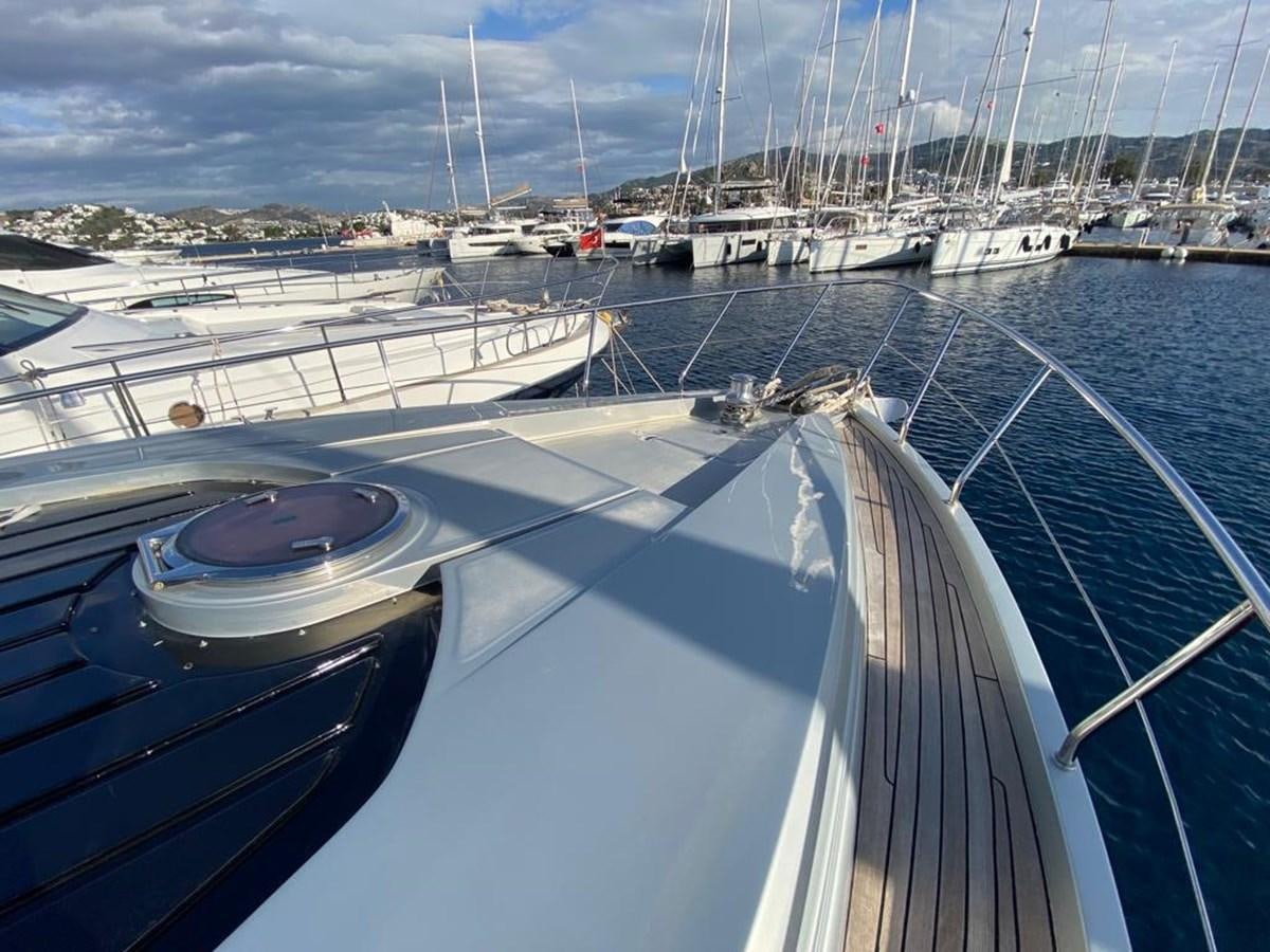 a group of boats are parked in a harbor aboard PERSHING 64 Yacht for Sale