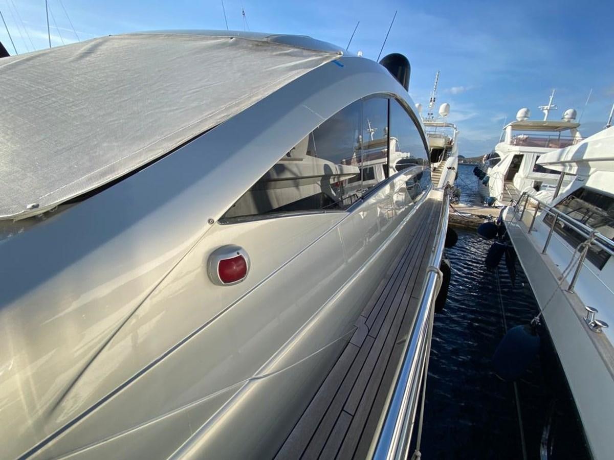 a white yacht docked aboard PERSHING 64 Yacht for Sale