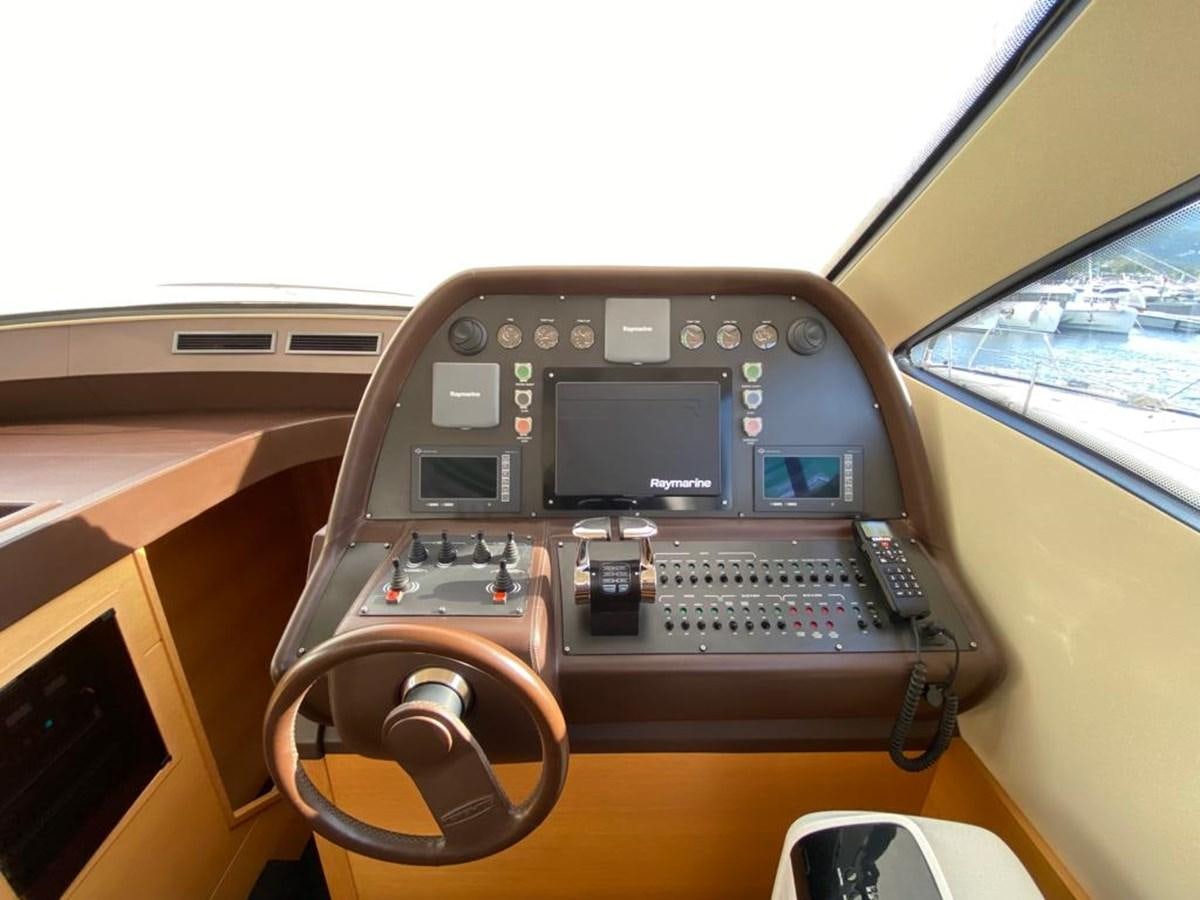 a radio on a vehicle aboard PERSHING 64 Yacht for Sale