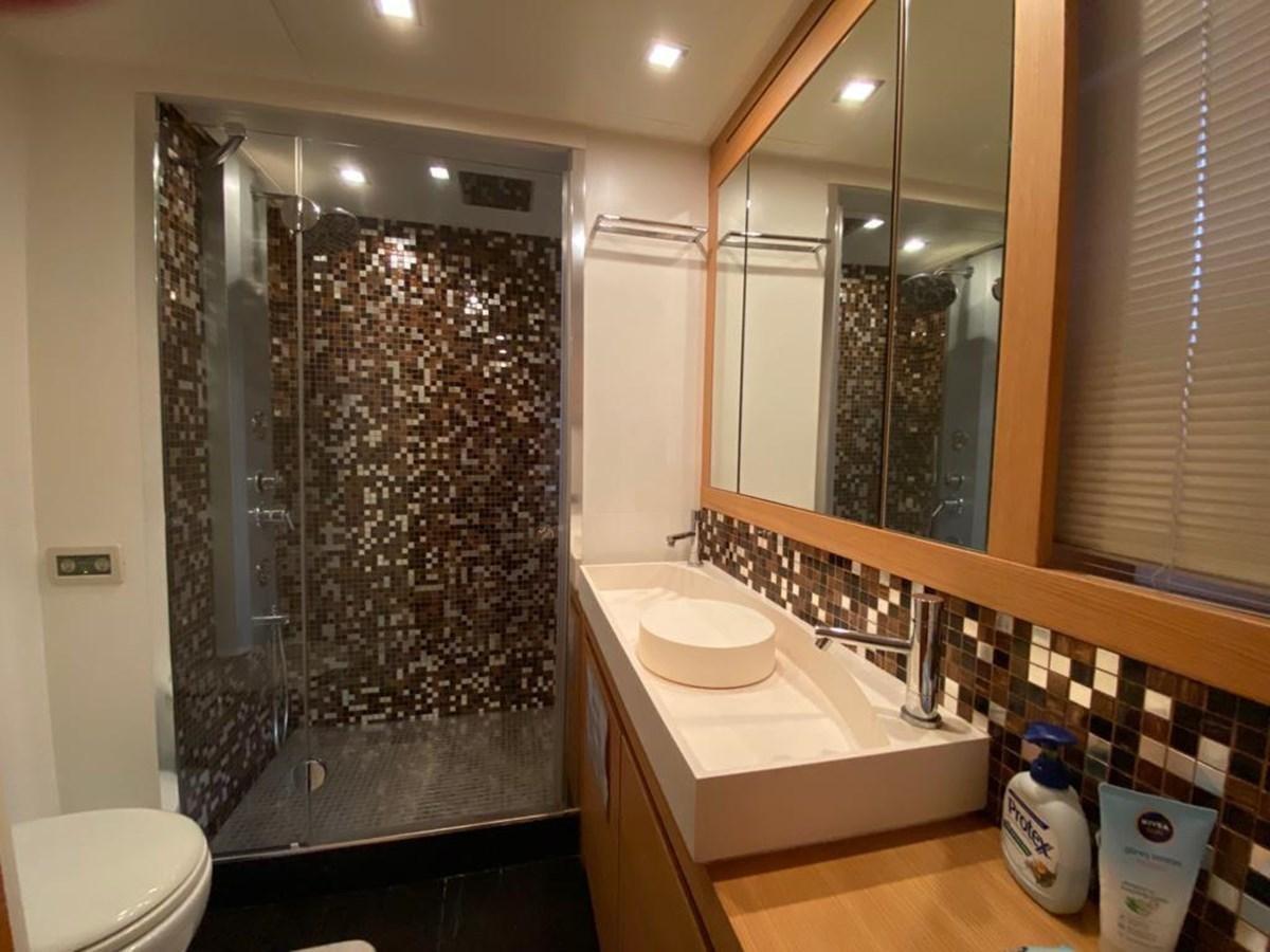 a bathroom with a large shower aboard PERSHING 64 Yacht for Sale