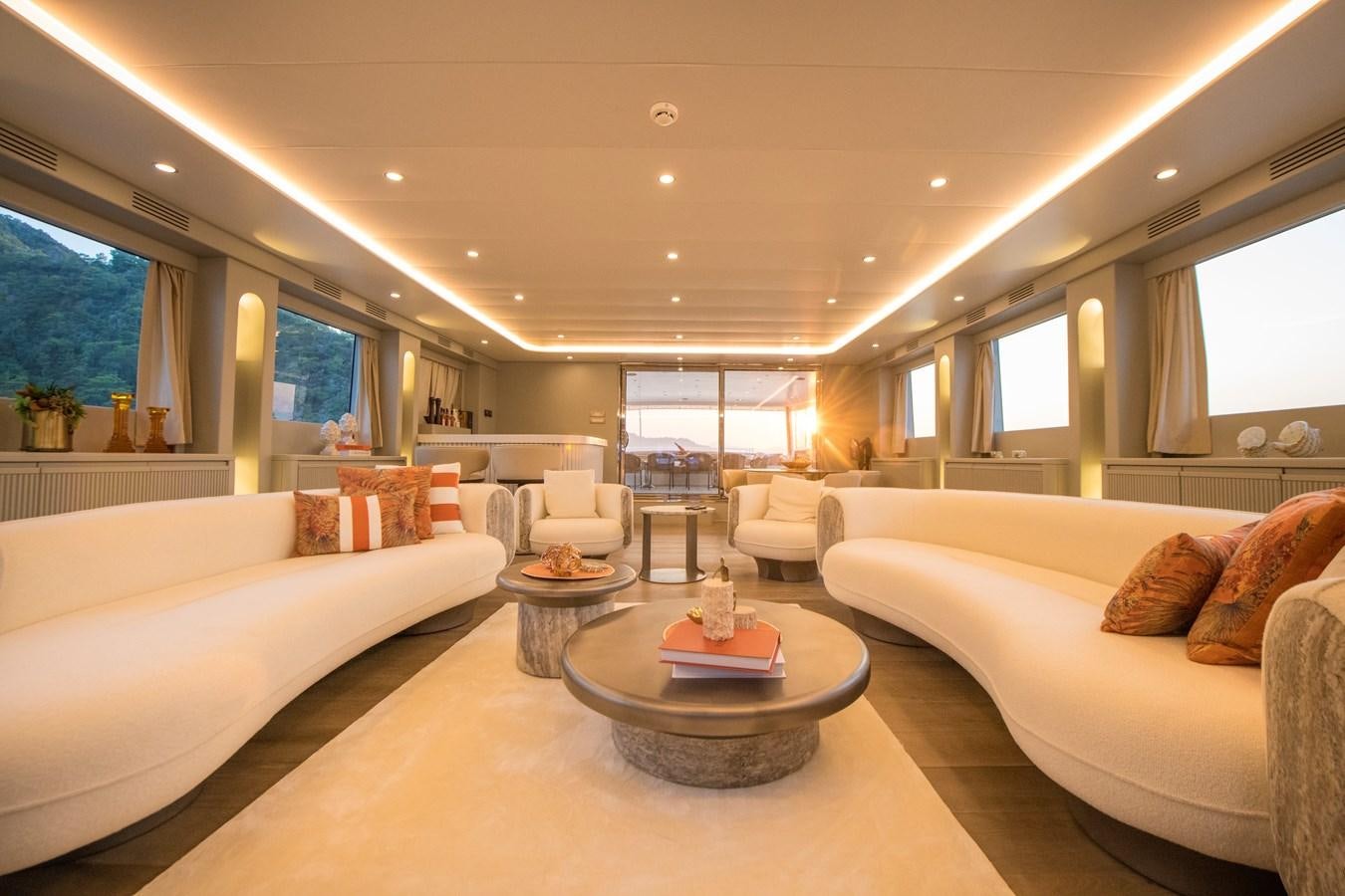 a living room with a couch and a table aboard MOTORSAILOR 41M Yacht for Sale