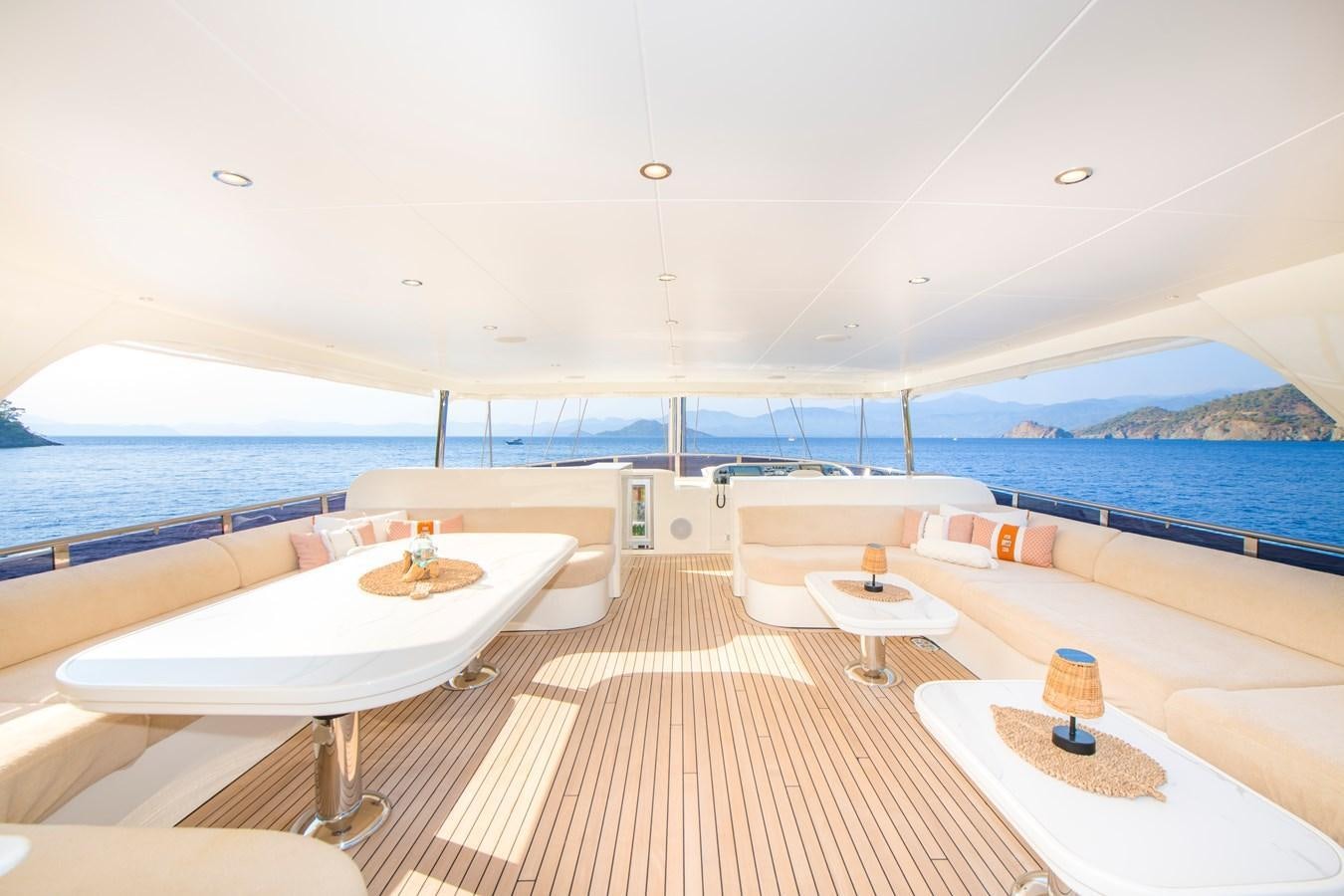 a room with a table and chairs aboard MOTORSAILOR 41M Yacht for Sale