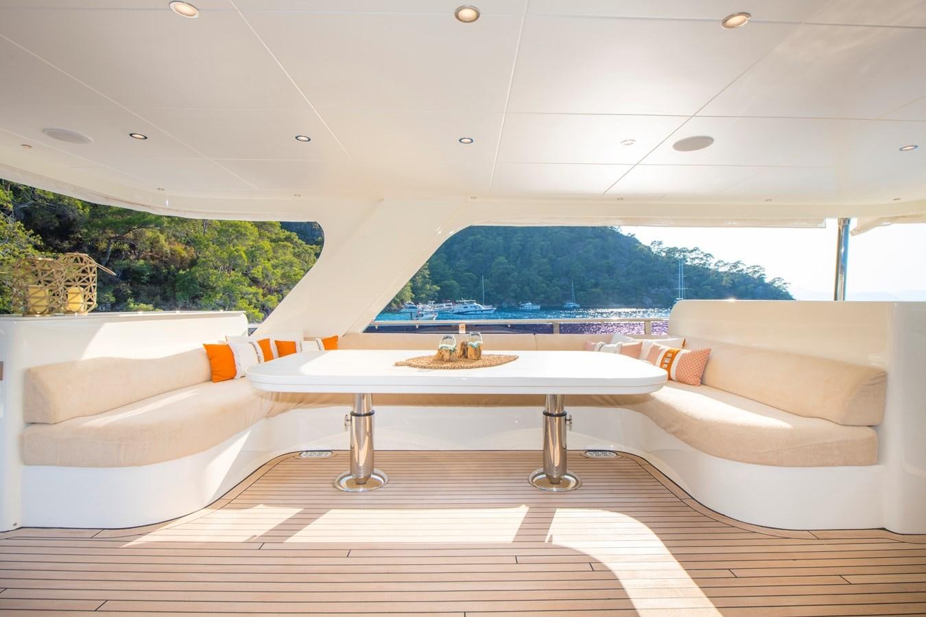 a modern living room with a large pool and a large mountain aboard MOTORSAILOR 41M Yacht for Sale