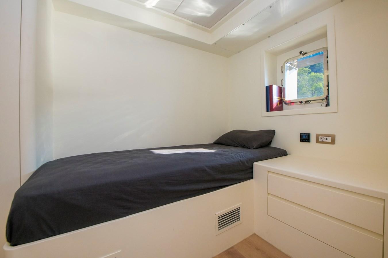 a bed in a room aboard MOTORSAILOR 41M Yacht for Sale