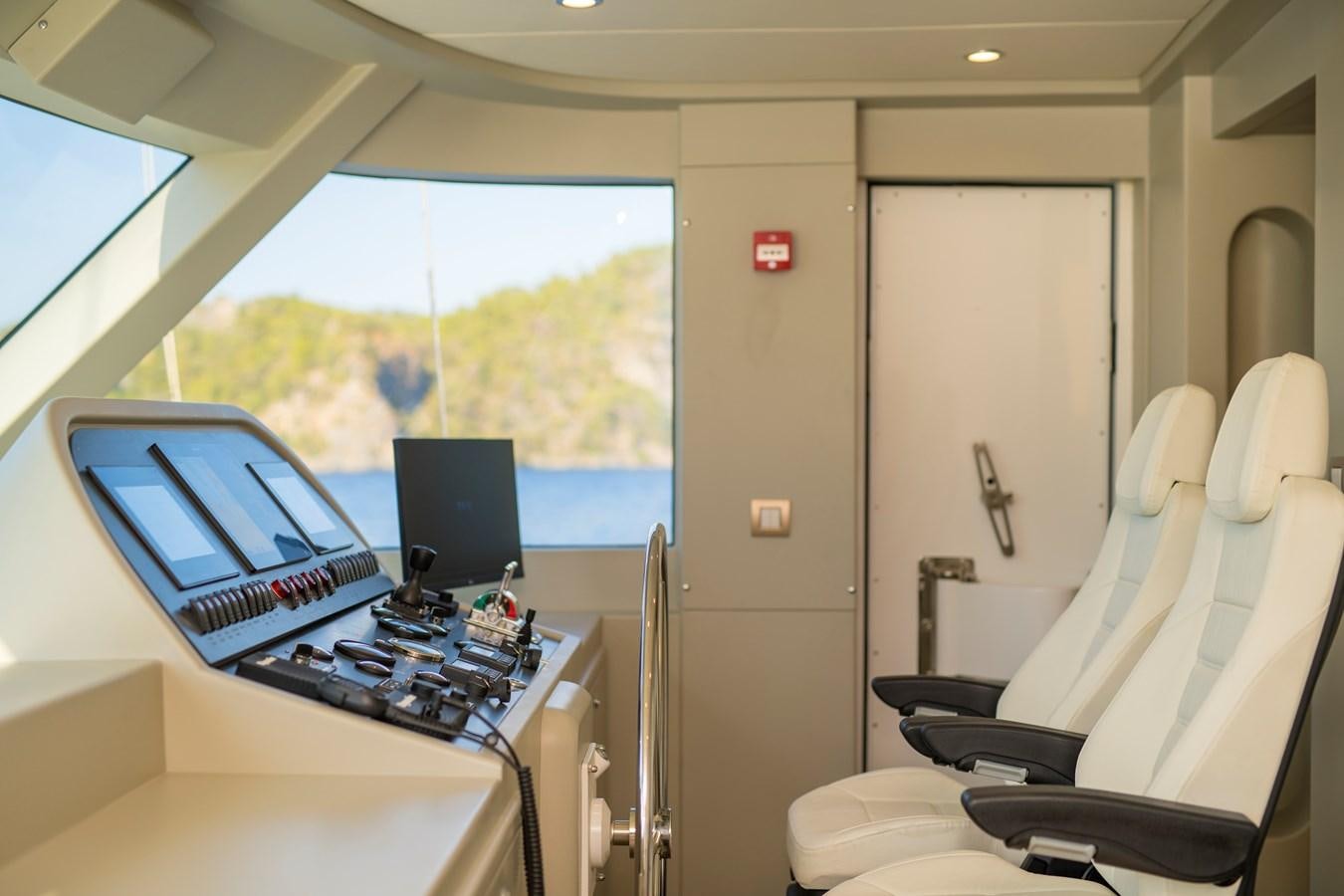 a room with a desk and computer aboard MOTORSAILOR 41M Yacht for Sale