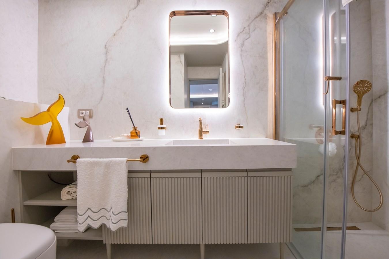 a bathroom with a sink and a mirror aboard MOTORSAILOR 41M Yacht for Sale