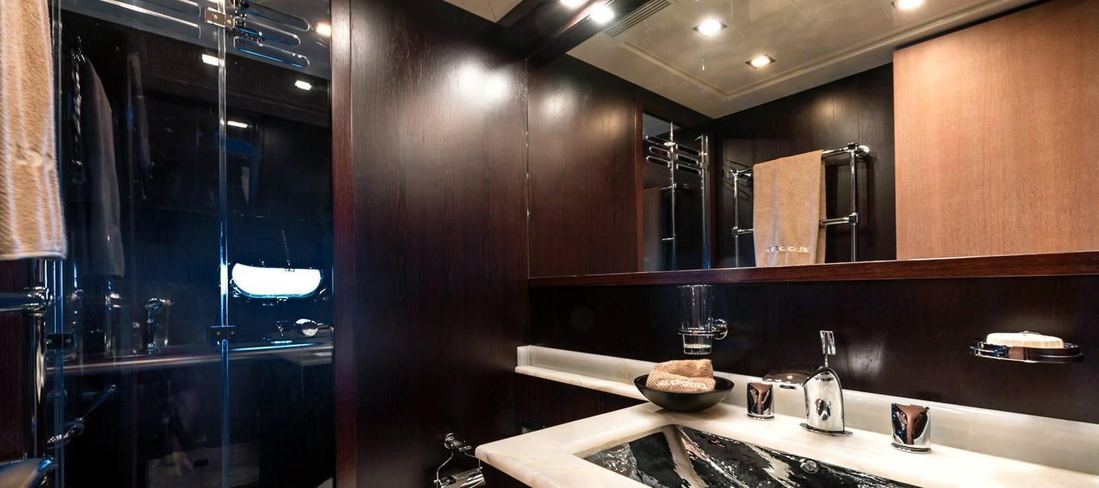 a bathroom with a large mirror aboard BLOOMS Yacht for Sale