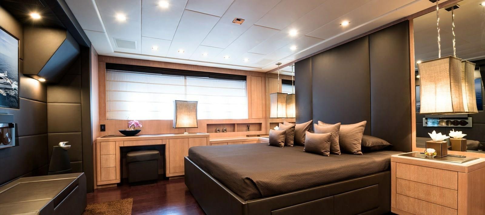 a bed in a room aboard BLOOMS Yacht for Sale