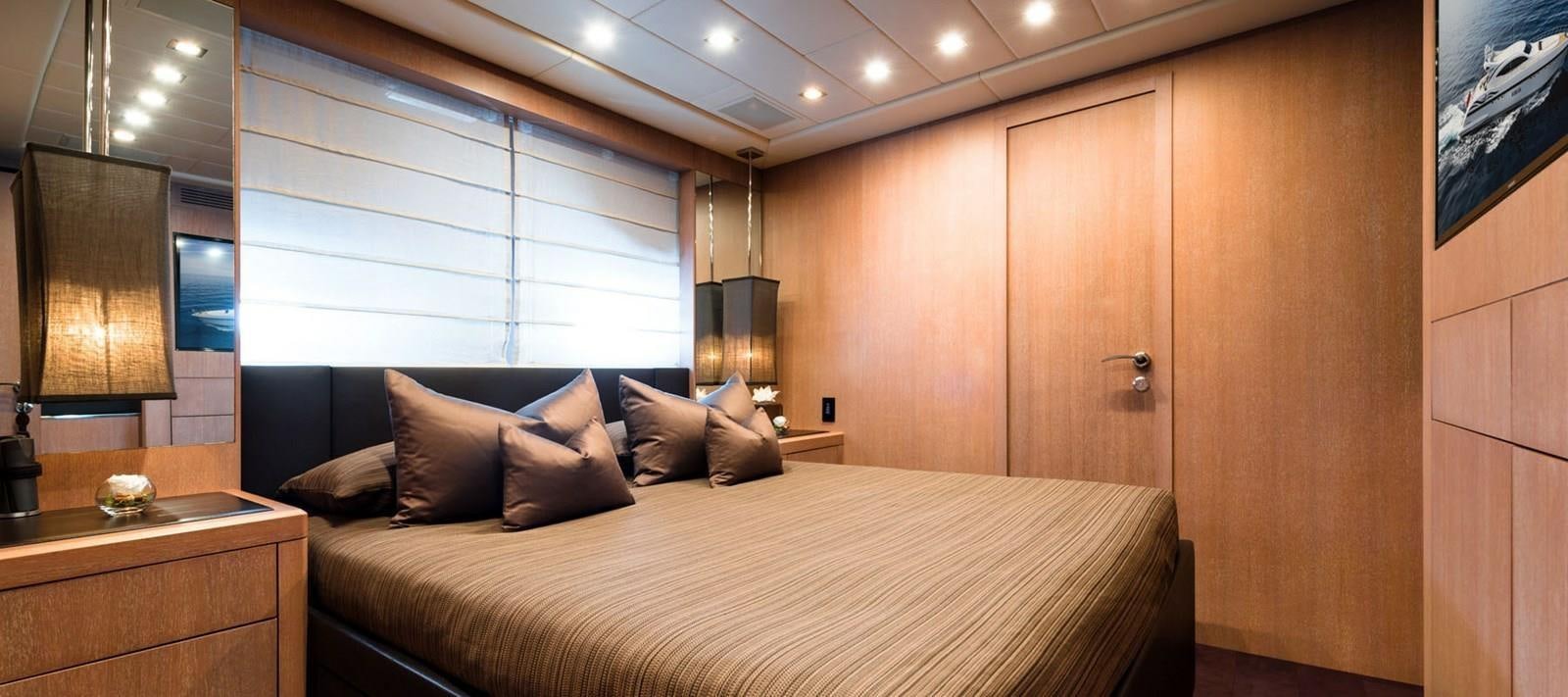 a bed in a room aboard BLOOMS Yacht for Sale