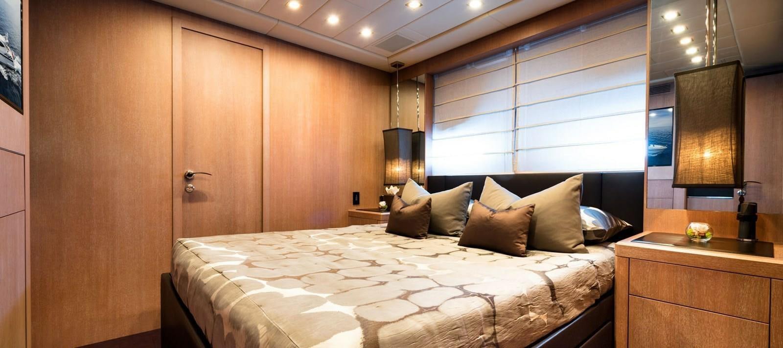 a bed in a room aboard BLOOMS Yacht for Sale