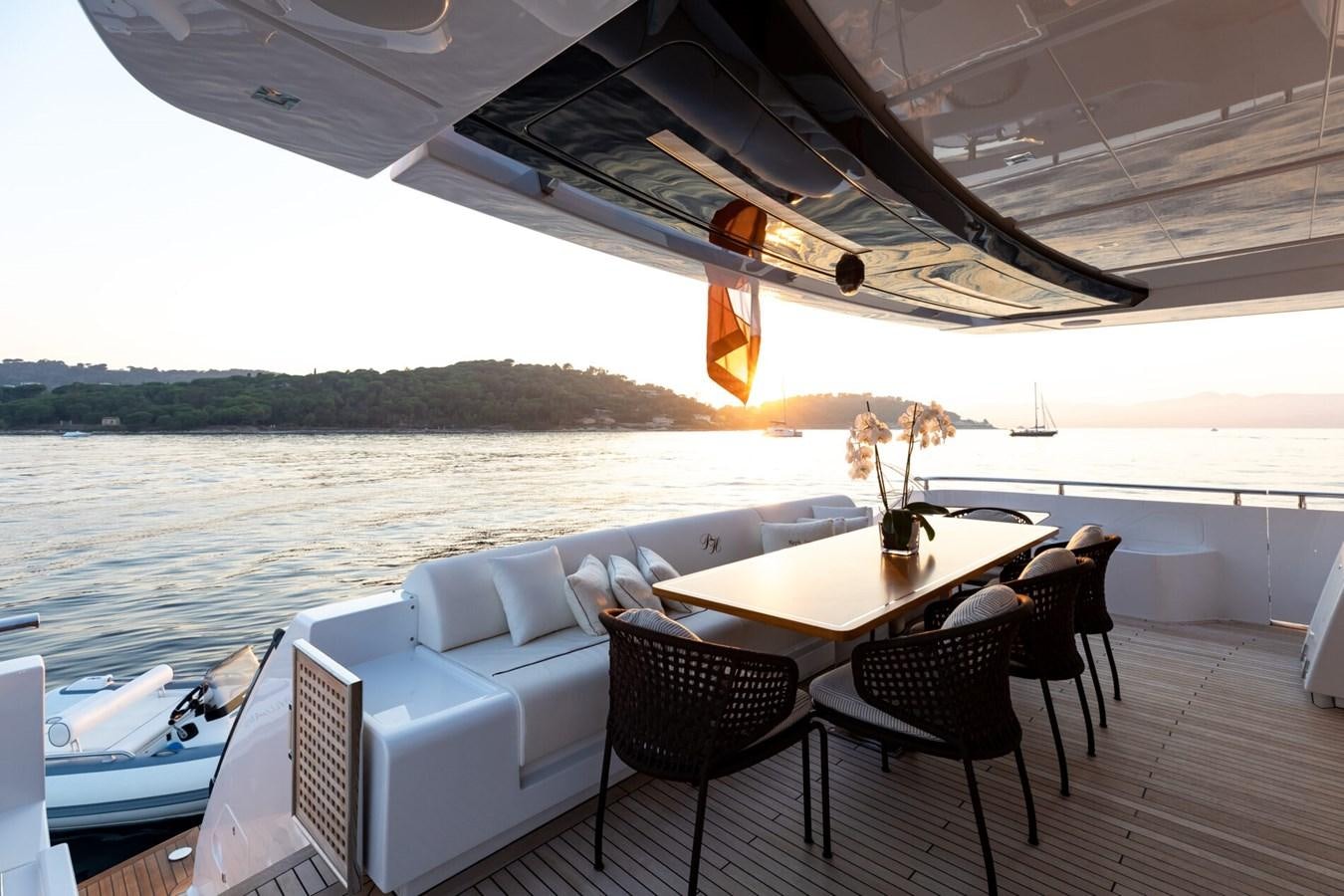a boat with a table and chairs on a deck aboard RAPH SEVEN II Yacht for Sale