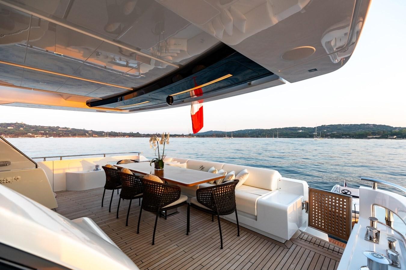 a table and chairs on a deck aboard RAPH SEVEN II Yacht for Sale