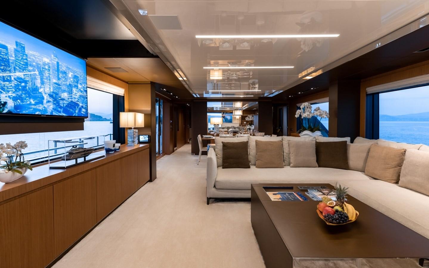 a living room with a couch and a table aboard RAPH SEVEN II Yacht for Sale