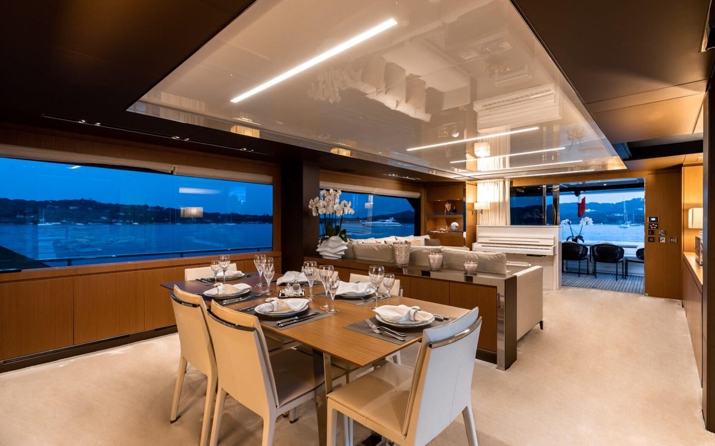 a conference room with a large screen aboard RAPH SEVEN II Yacht for Sale