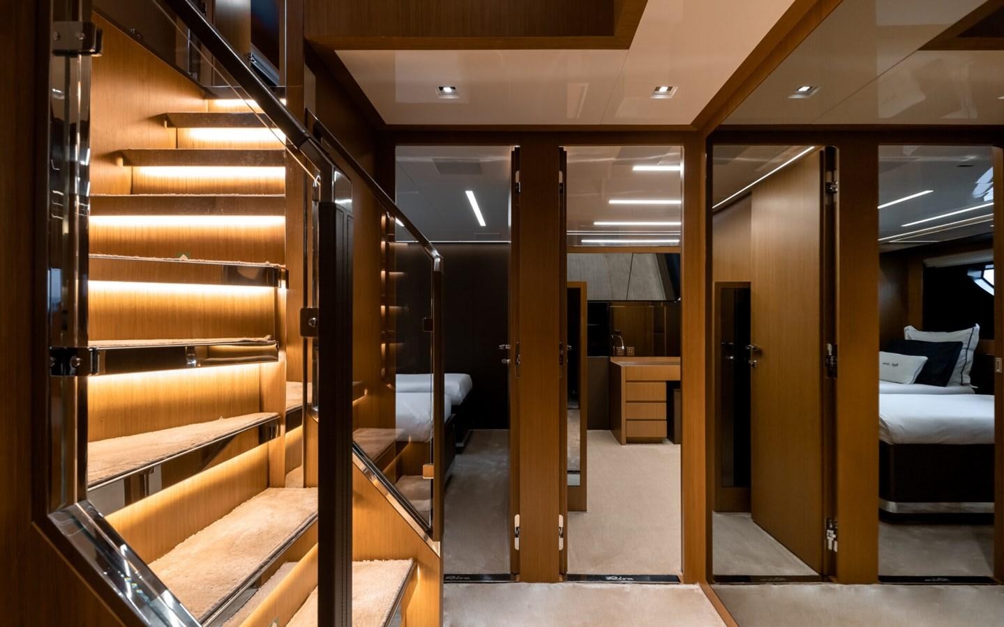 a room with a bed and a desk aboard RAPH SEVEN II Yacht for Sale